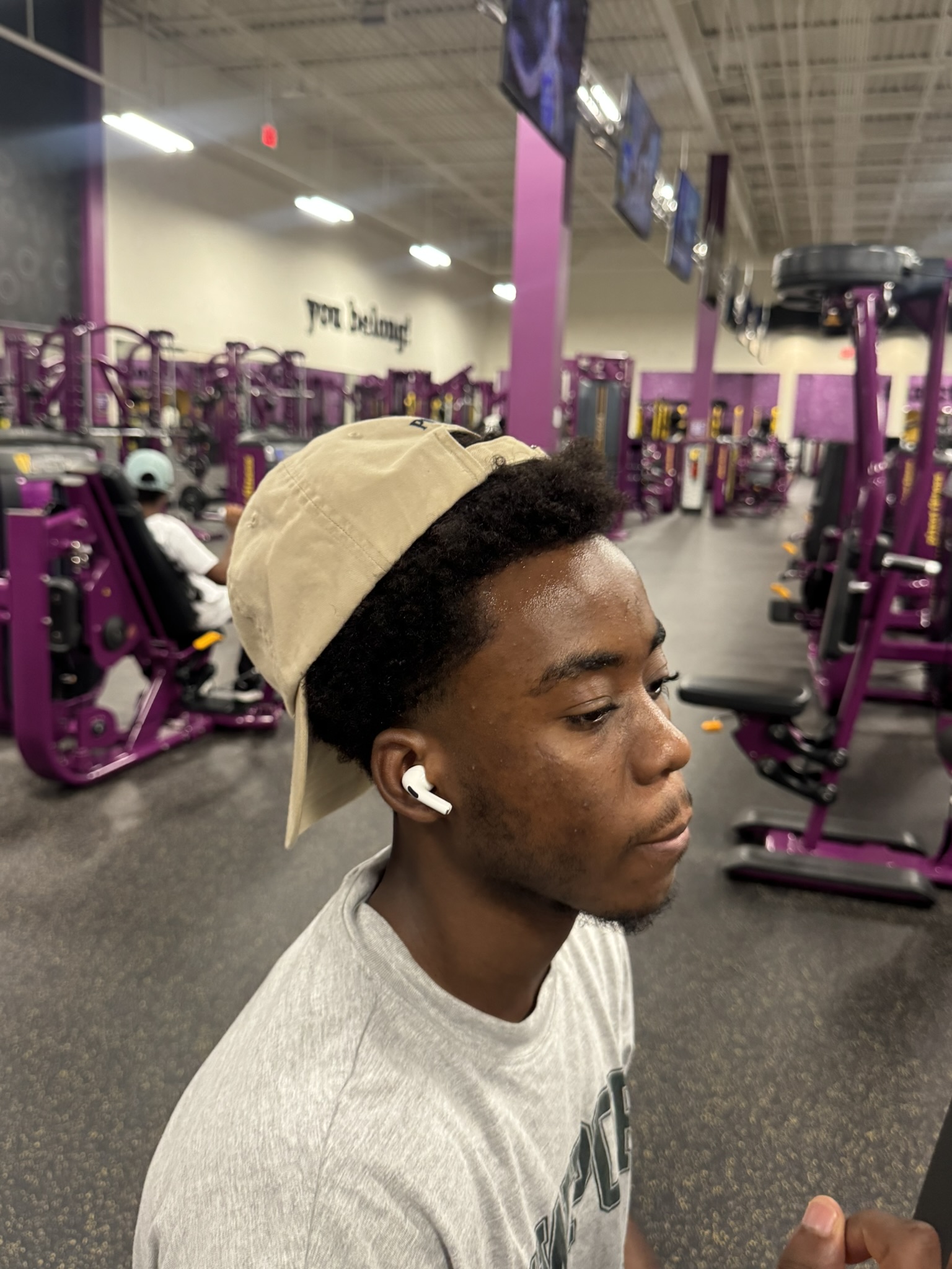 Amir wearing a backwards cap at Planet Fitness in Tampa Florida