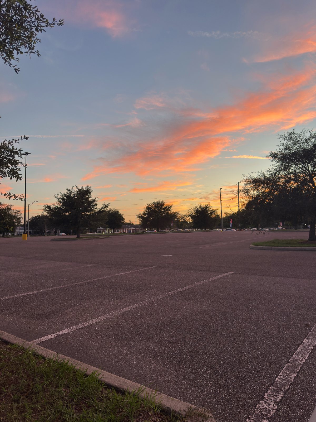Orange sunset sky over an empty parking lot in Tampa Florida